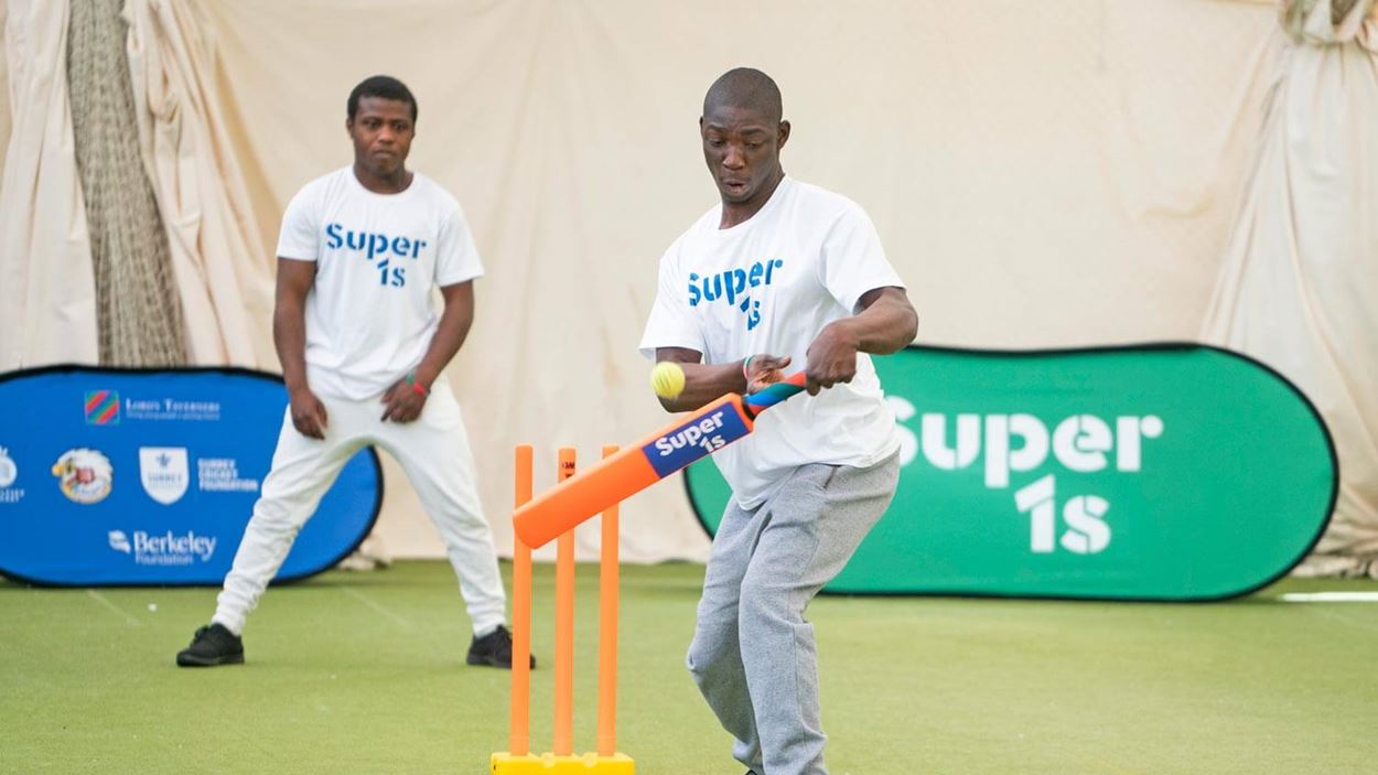 Player missing a swing at a cricket ball