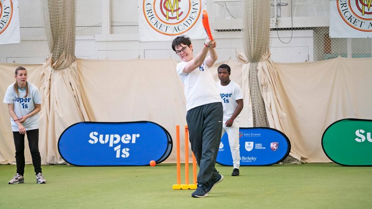 Player hitting a cricket ball