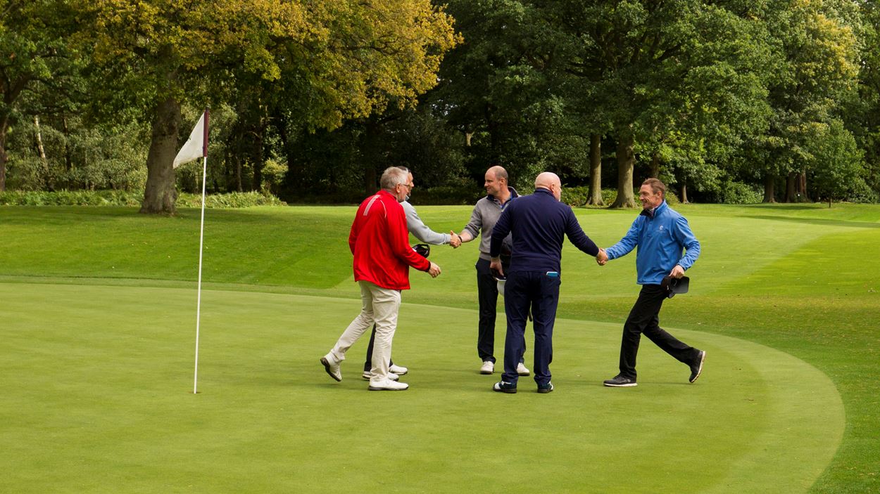 Handshakes all round at the final hole.jpg