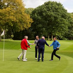 Handshakes all round at the final hole.jpg