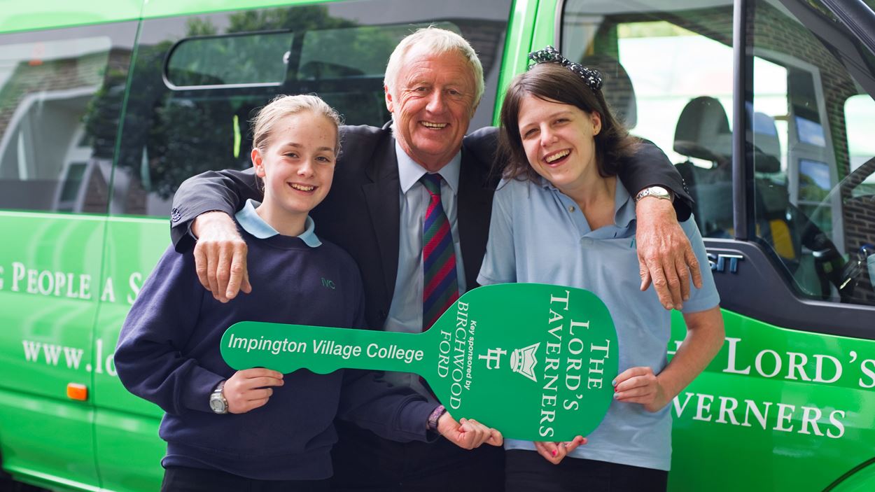 Chris Tarrant with pupils from Impington Village College and their new Lord's Taverners minibus in 2011.jpg