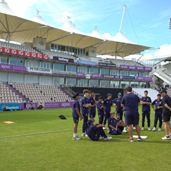 Team huddle with Pavilion background.png