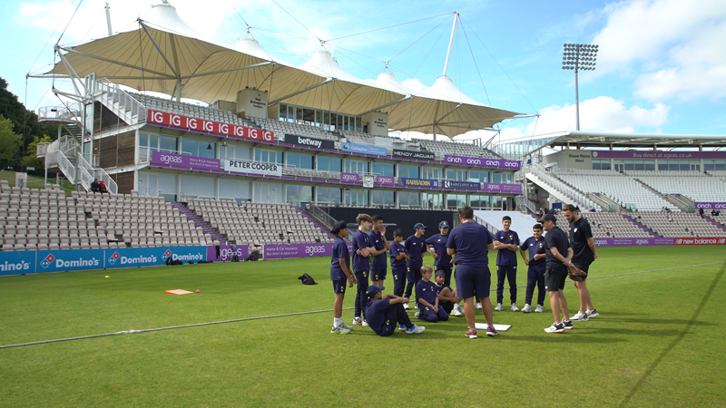 Team huddle with Pavilion background.png