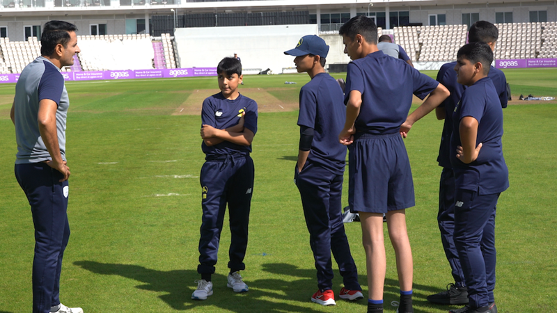 Abdul (cross armed) talking to Mohammad Abbas.png