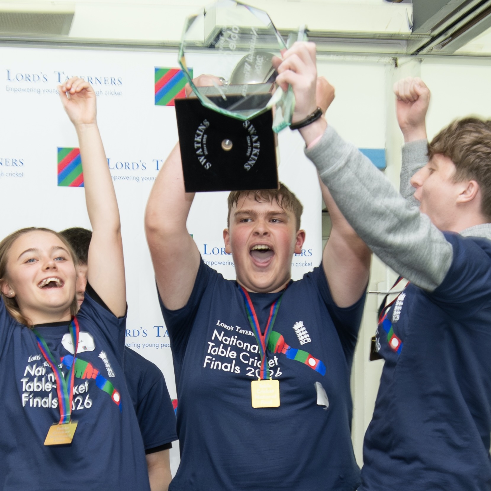 Newton Bridge Academy table cricket team cheering with trophy.jpeg