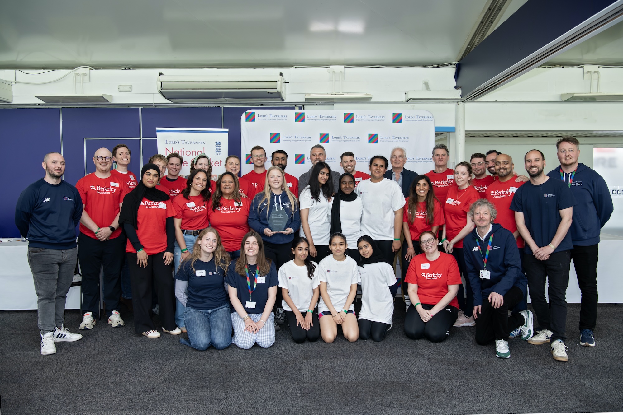 Berkeley Foundation, Lord's Taverners staff and Young Leaders pose in group shot with Better Society Award in the Nursery Pavilion at Lord's Cricket Ground.jpeg