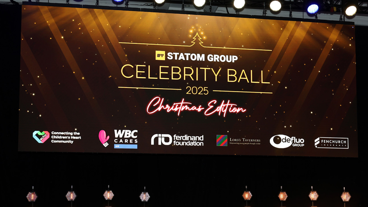 Statom Group Ball background screen behind stage.jpg